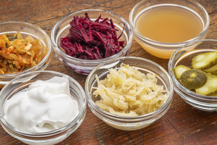 Bowls of fermented foods to strengthen your gut microbiome.